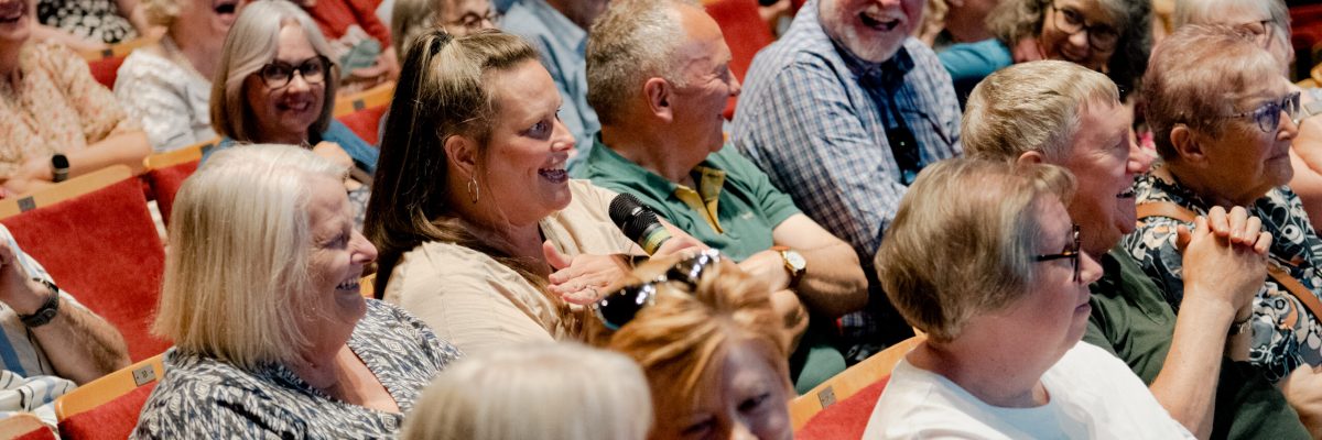 Theatre audience asking question 8